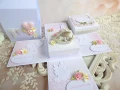 exploding box na chrzest w torebce z aniołkiem w kolorach: biały, ivory, różowy, zielony